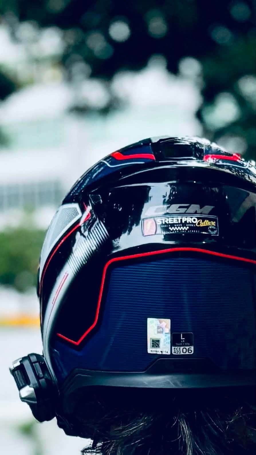 Rider wearing a CGM helmet with a Street Pro Culture decal